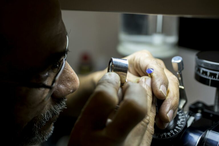 A Man Inspecting a Gemstone